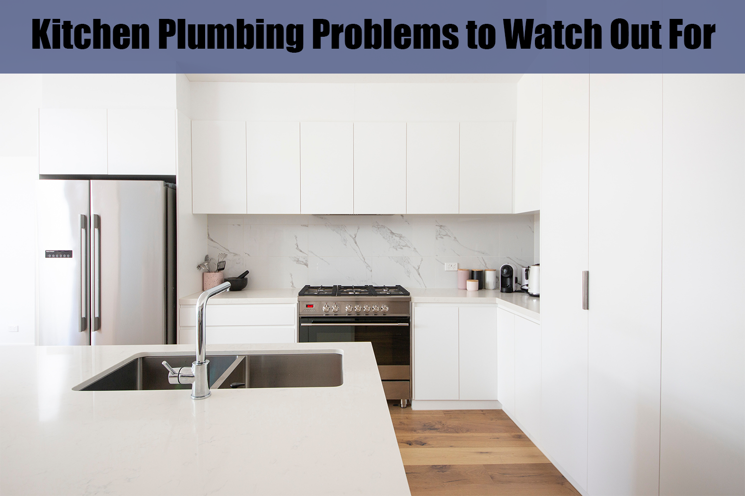 A clean white kitchen; to keep clean, it's important to watch out for kitchen plumbing problems.