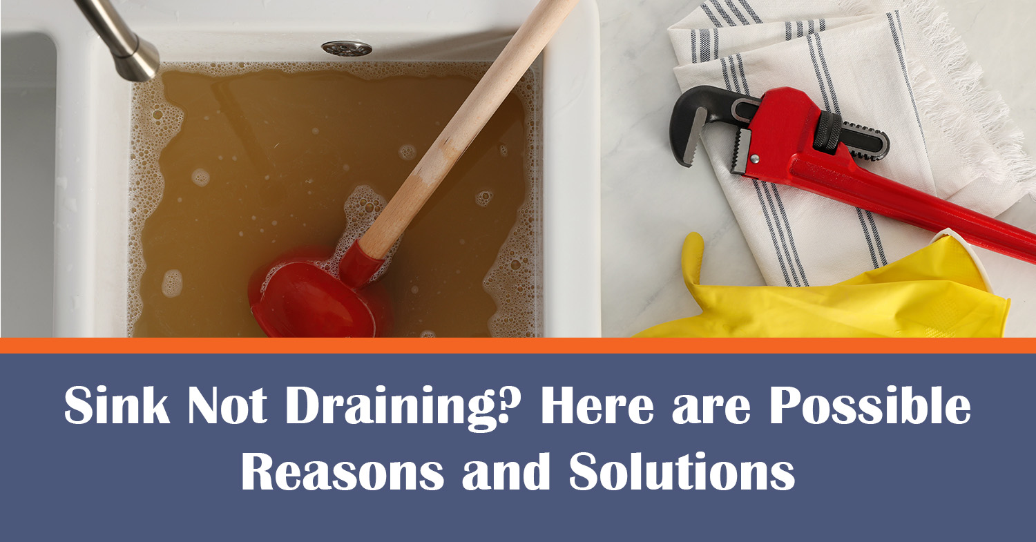 Sink not draining, with yellow gloves and a red wrench beside sink.