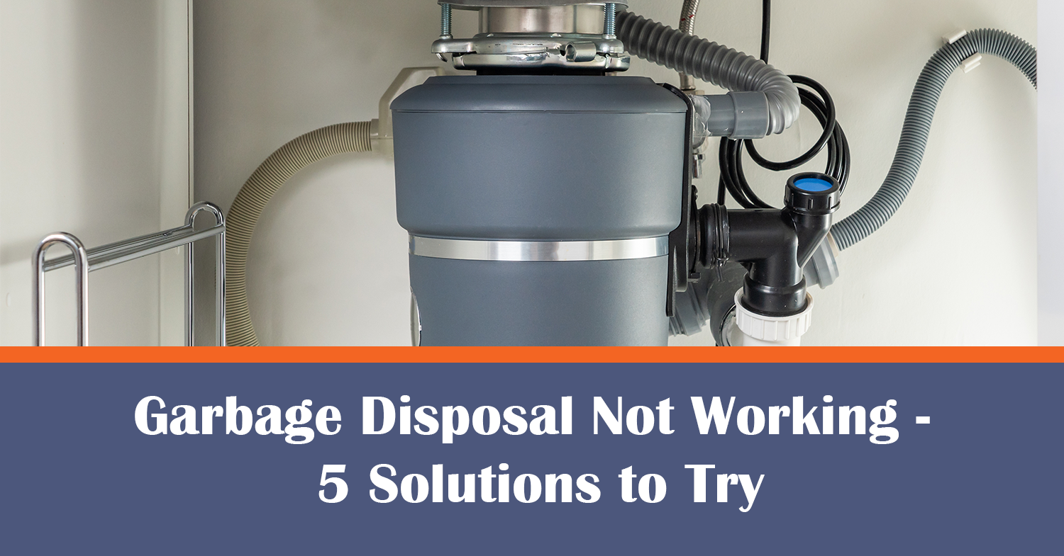 A shot of a garbage disposal not working under the kitchen sink.